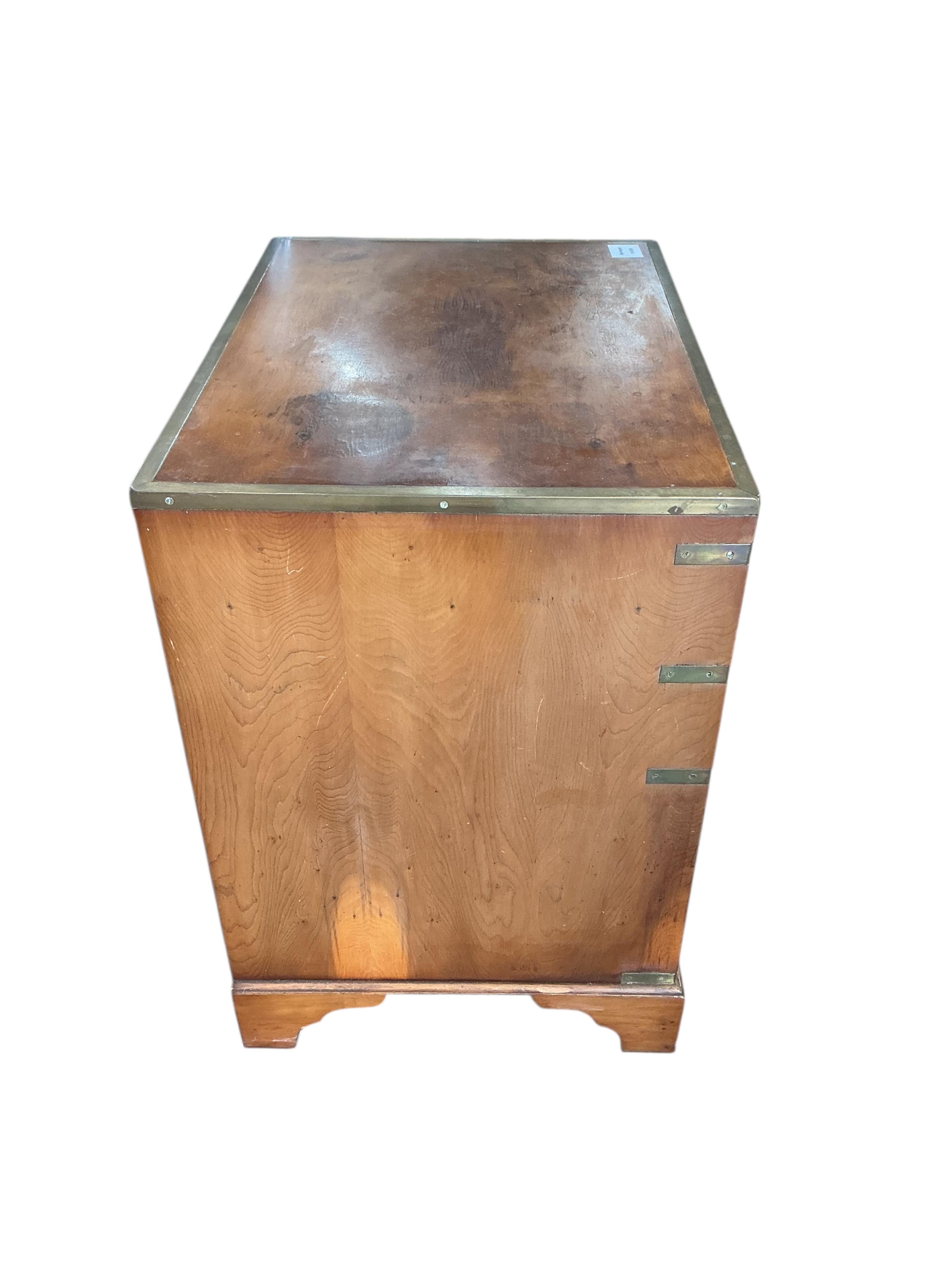 A reproduction brass mounted military style yew side cabinet, width 56cm, depth 40cm, height 60cm